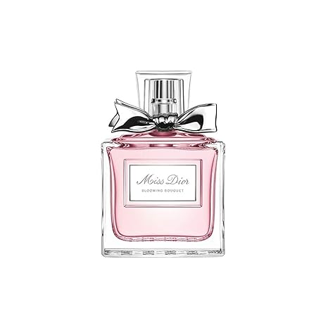 Miss Dior perfume bottle with pink liquid and silver bow on a white background